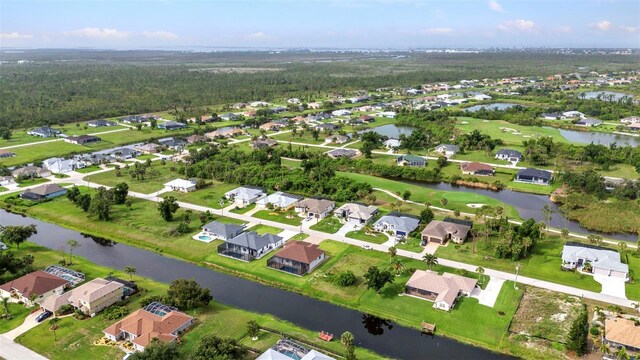 15 Tournament Rd, Rotonda West, FL 33947 - aerial view of property's location with nearby suburban area and a large body of water