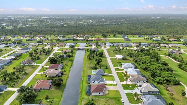 15 Tournament Rd, Rotonda West, FL 33947 - aerial view of property and surrounding area featuring nearby suburban area and a nearby body of water