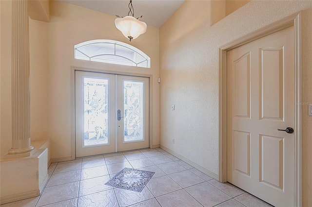 25538 Rampart Blvd, Punta Gorda, FL 33983 - entryway with french doors and light tile patterned floors