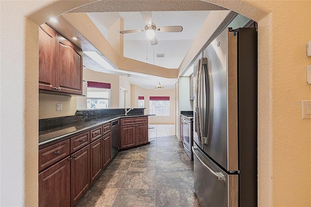 25538 Rampart Blvd, Punta Gorda, FL 33983 - kitchen featuring appliances with stainless steel finishes, ceiling fan, a peninsula, a sink, and a textured wall