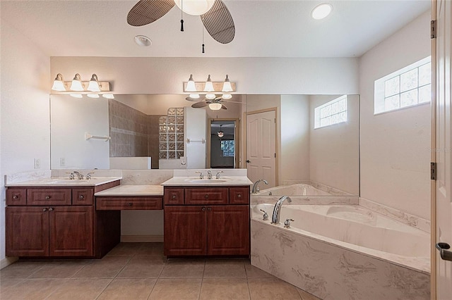 25538 Rampart Blvd, Punta Gorda, FL 33983 - bathroom featuring a ceiling fan, a bath, two vanities, and tile patterned flooring