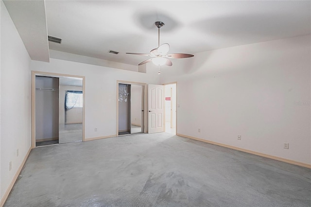 25538 Rampart Blvd, Punta Gorda, FL 33983 - unfurnished bedroom with two closets, baseboards, light carpet, and ceiling fan