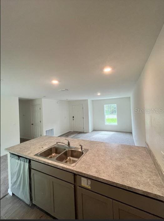 4310 Alvin St, Hastings, FL 32145 - kitchen with a sink, open floor plan, dishwasher, light countertops, and recessed lighting