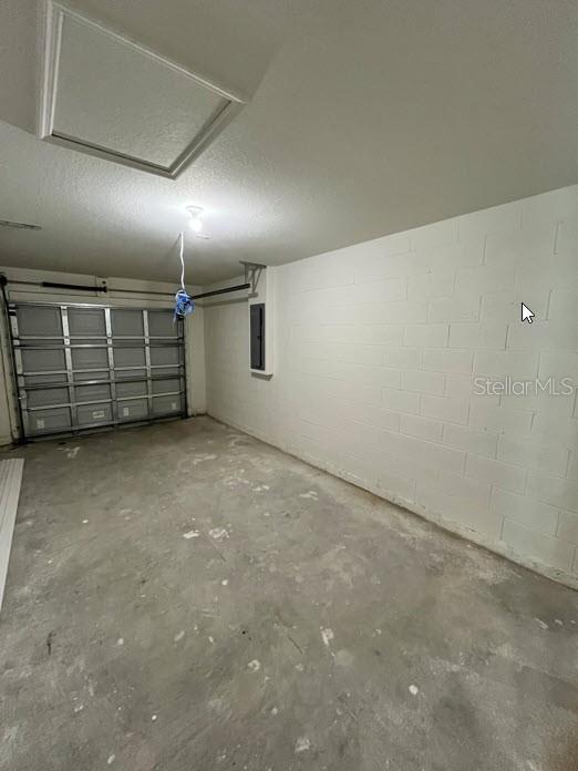 4310 Alvin St, Hastings, FL 32145 - garage with electric panel and concrete block wall