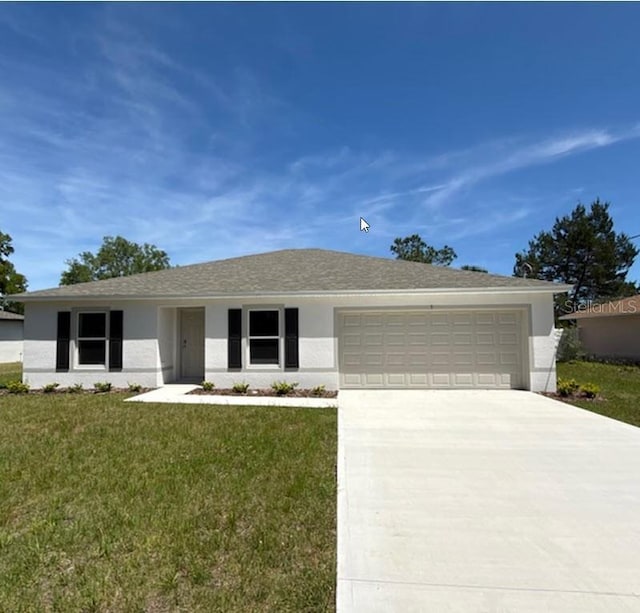5 Princess Luise Ln, Palm Coast, FL 32164 - ranch-style house with a garage, driveway, a front lawn, and stucco siding