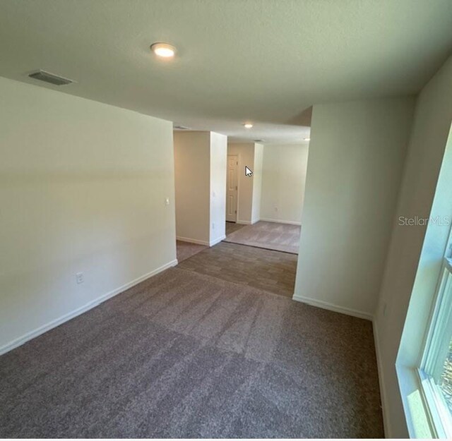 5 Princess Luise Ln, Palm Coast, FL 32164 - carpeted spare room featuring baseboards and recessed lighting