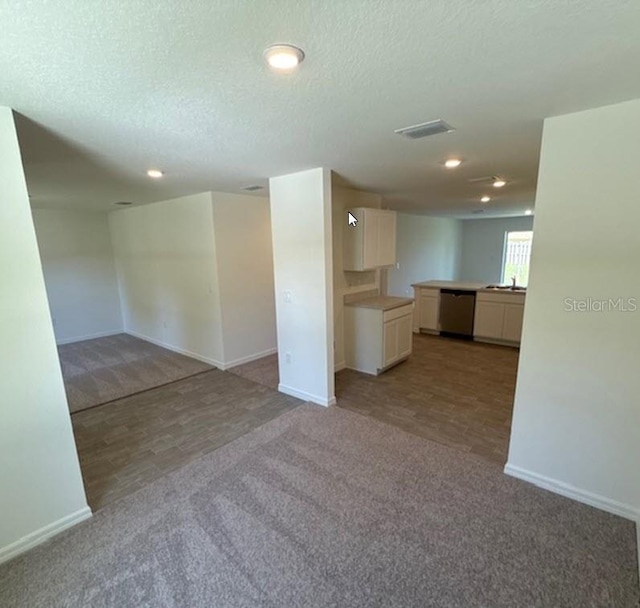 5 Princess Luise Ln, Palm Coast, FL 32164 - unfurnished living room featuring carpet floors, baseboards, recessed lighting, and a textured ceiling