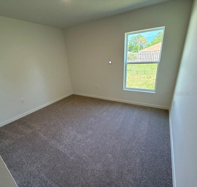 5 Princess Luise Ln, Palm Coast, FL 32164 - carpeted empty room featuring baseboards