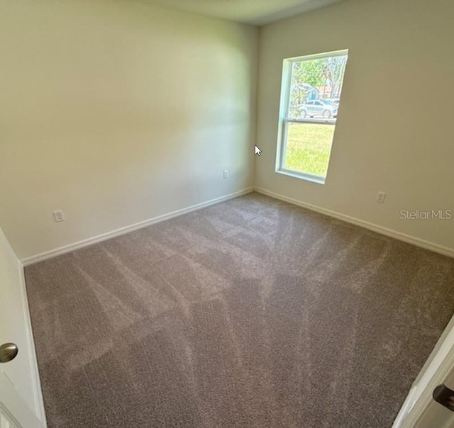 5 Princess Luise Ln, Palm Coast, FL 32164 - carpeted spare room with baseboards