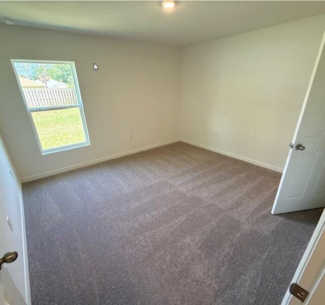 5 Princess Luise Ln, Palm Coast, FL 32164 - carpeted spare room featuring baseboards