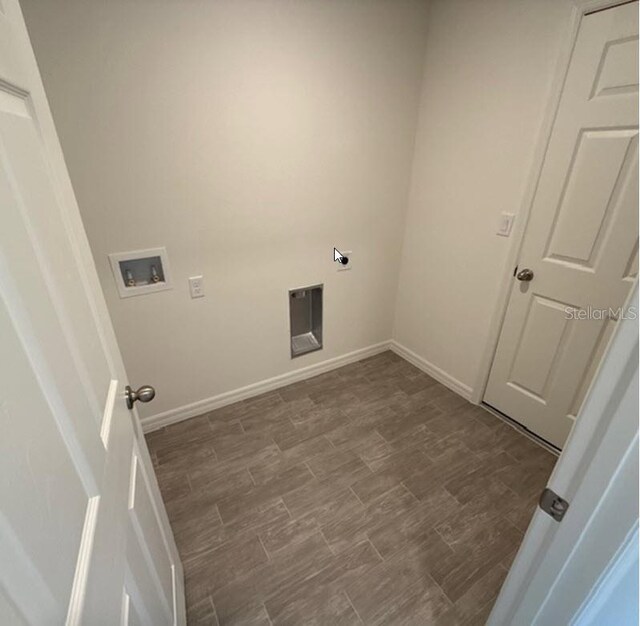 5 Princess Luise Ln, Palm Coast, FL 32164 - laundry area with hookup for a washing machine, baseboards, electric dryer hookup, and dark wood-type flooring
