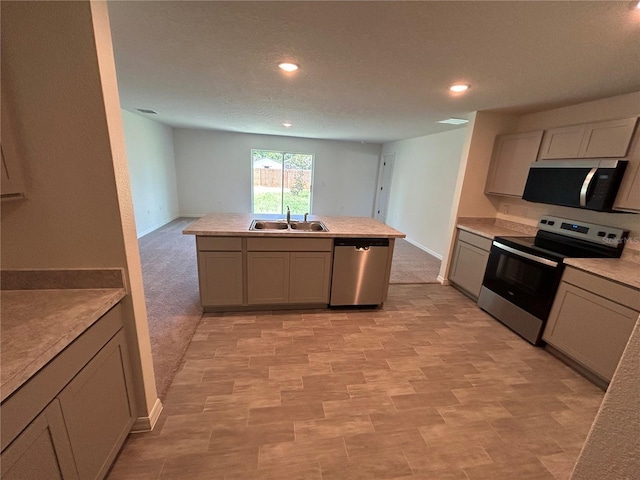 4 Zodiacal Pl, Palm Coast, FL 32164 - kitchen with stainless steel appliances, a sink, recessed lighting, light countertops, and gray cabinets