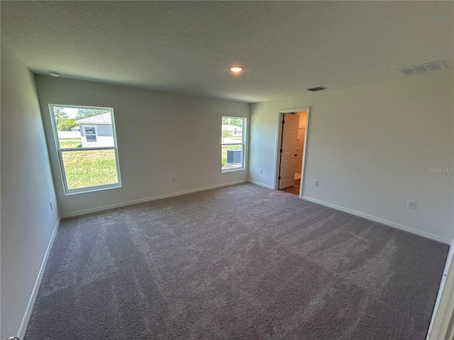 4 Zodiacal Pl, Palm Coast, FL 32164 - carpeted spare room featuring baseboards, a textured ceiling, and recessed lighting