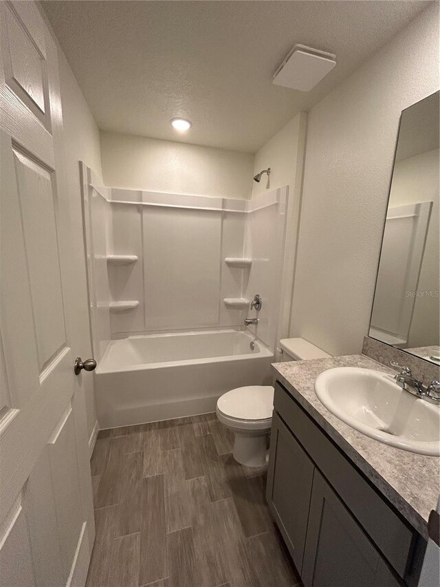 4 Zodiacal Pl, Palm Coast, FL 32164 - full bath featuring shower / bath combination, toilet, vanity, wood finished floors, and a textured ceiling