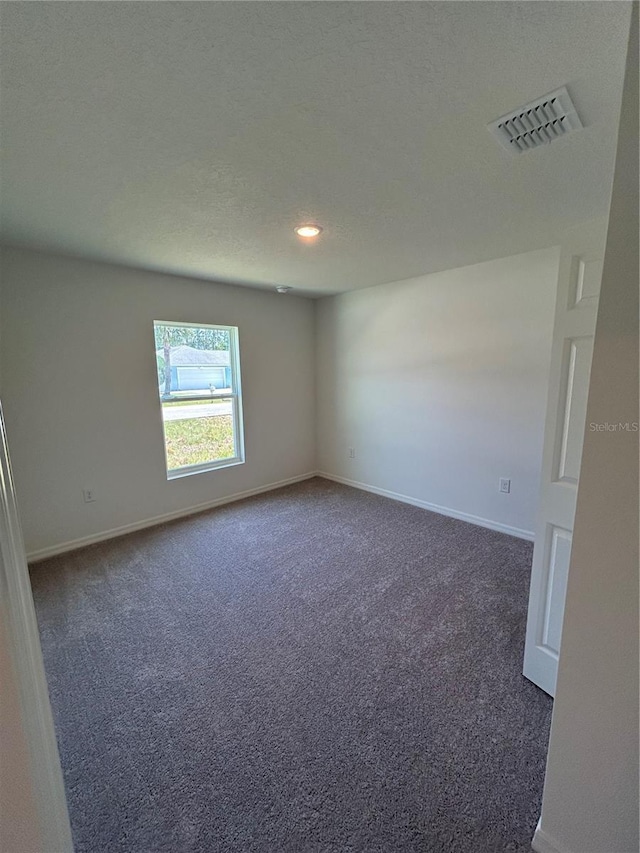 4 Zodiacal Pl, Palm Coast, FL 32164 - carpeted empty room with baseboards, recessed lighting, and a textured ceiling