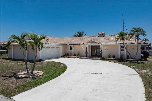 259 Fields Ter, Port Charlotte, FL 33952 - single story home featuring an attached garage, driveway, a tiled roof, and stucco siding