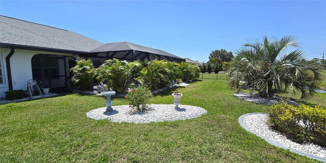 7148 N Blue Sage, Punta Gorda, FL 33955 - view of green lawn with a lanai