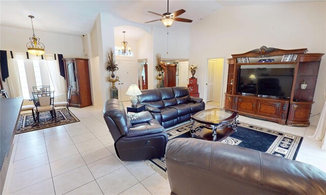 7148 N Blue Sage, Punta Gorda, FL 33955 - living room with lofted ceiling, light tile patterned flooring, ceiling fan, and a chandelier