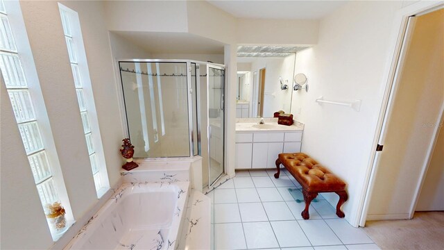 7148 N Blue Sage, Punta Gorda, FL 33955 - bathroom with a stall shower, vanity, a bath, and tile patterned flooring