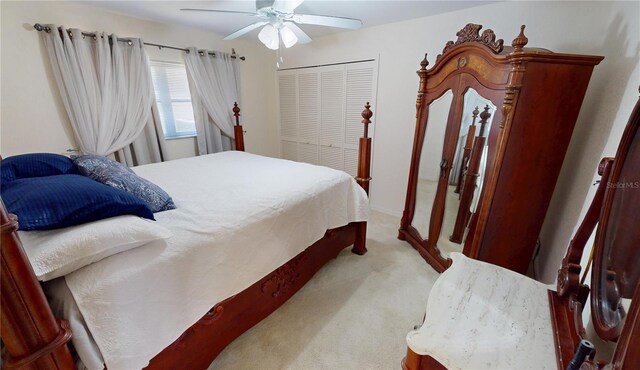 7148 N Blue Sage, Punta Gorda, FL 33955 - bedroom with light carpet, a ceiling fan, and a closet