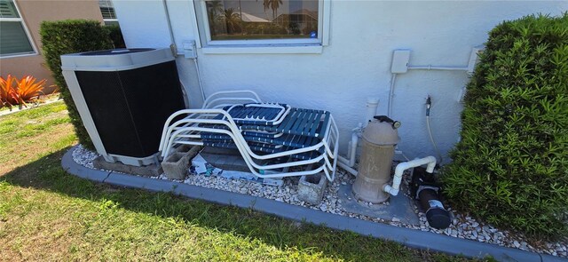 7148 N Blue Sage, Punta Gorda, FL 33955 - exterior view of central AC unit and stucco siding
