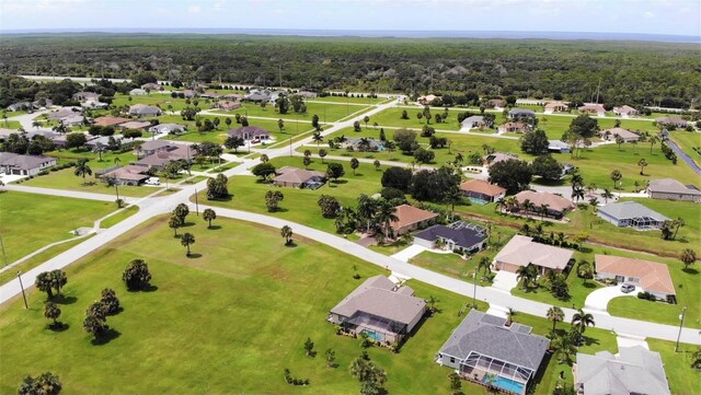 7148 N Blue Sage, Punta Gorda, FL 33955 - aerial view of residential area featuring a heavily wooded area