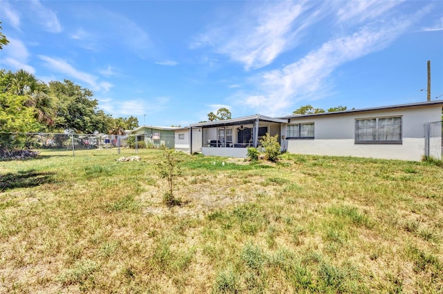2465 Deedra St, Port Charlotte, FL 33952 - back of property with a sunroom and stucco siding