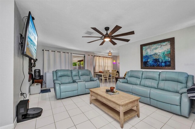 2465 Deedra St, Port Charlotte, FL 33952 - living room featuring a ceiling fan and light tile patterned floors