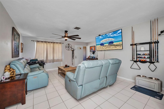 2465 Deedra St, Port Charlotte, FL 33952 - living room featuring light tile patterned floors, ceiling fan, and baseboards