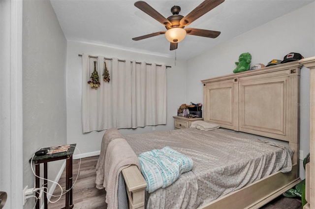 2465 Deedra St, Port Charlotte, FL 33952 - bedroom with wood finished floors, baseboards, and ceiling fan