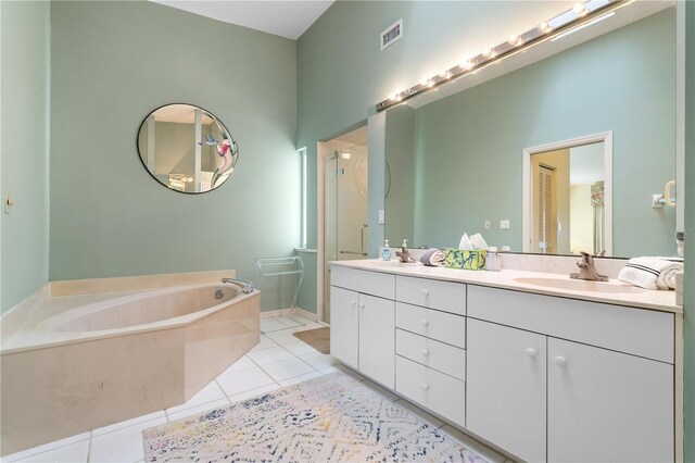 2521 W Marion Ave Unit 912, Punta Gorda, FL 33950 - full bathroom featuring tile patterned flooring, a stall shower, a garden tub, and double vanity