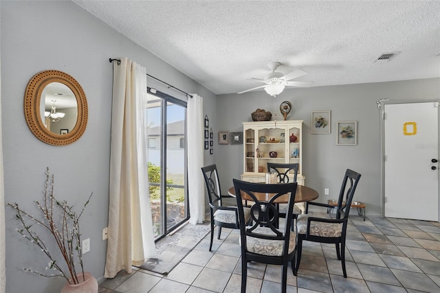 4358 Pates St, Port Charlotte, FL 33948 - dining area with a textured ceiling, a ceiling fan, and light tile patterned floors