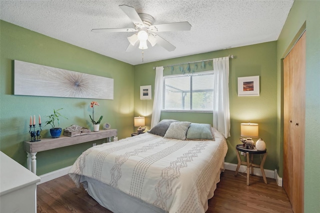 4358 Pates St, Port Charlotte, FL 33948 - bedroom featuring wood finished floors, a closet, a textured ceiling, ceiling fan, and baseboards