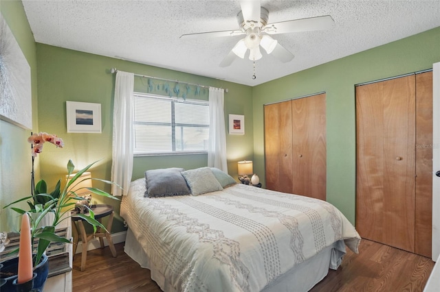 4358 Pates St, Port Charlotte, FL 33948 - bedroom featuring wood finished floors, multiple closets, a textured ceiling, and ceiling fan
