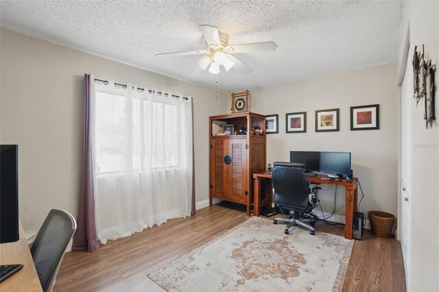 4358 Pates St, Port Charlotte, FL 33948 - home office with wood finished floors, ceiling fan, and a textured ceiling