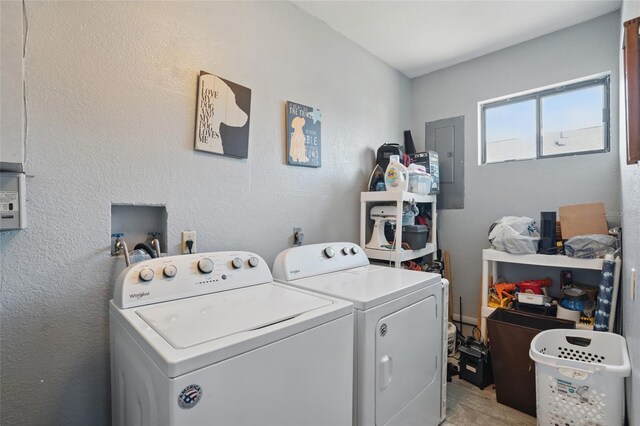 4358 Pates St, Port Charlotte, FL 33948 - laundry room featuring washer and dryer, electric panel, and light wood-style floors