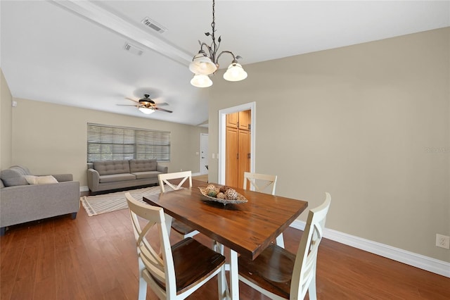 1039 Marlene St, Port Charlotte, FL 33952 - dining space with a chandelier, wood finished floors, a ceiling fan, and baseboards