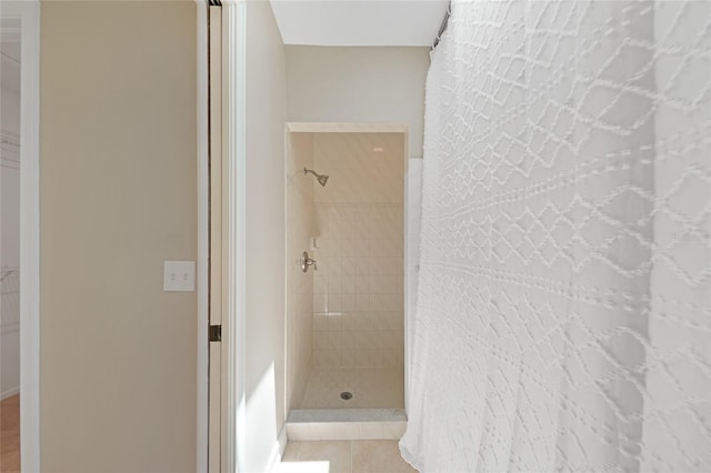 1039 Marlene St, Port Charlotte, FL 33952 - bathroom featuring a tile shower and tile patterned floors