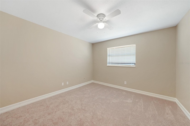 1039 Marlene St, Port Charlotte, FL 33952 - empty room with light colored carpet, baseboards, and a ceiling fan