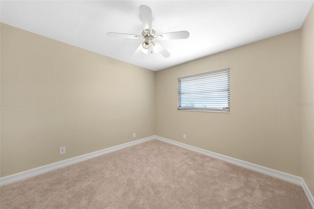 1039 Marlene St, Port Charlotte, FL 33952 - empty room with light carpet, baseboards, and a ceiling fan