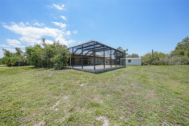 1039 Marlene St, Port Charlotte, FL 33952 - view of green lawn featuring a patio area, an outdoor pool, and glass enclosure