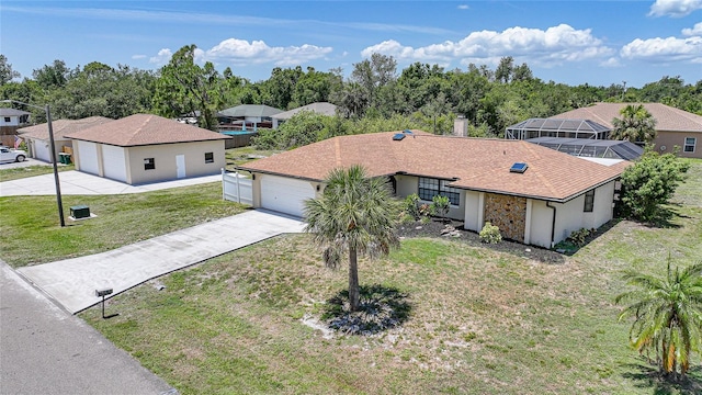 1039 Marlene St, Port Charlotte, FL 33952 - view of front facade with driveway, a front lawn, and a residential view