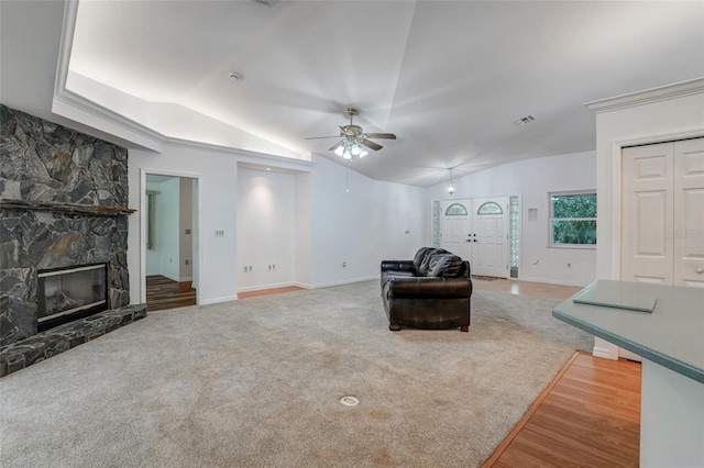 17340 Oak Creek Rd, Alva, FL 33920 - carpeted living area with ceiling fan, lofted ceiling, baseboards, a stone fireplace, and wood finished floors