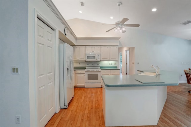 17340 Oak Creek Rd, Alva, FL 33920 - kitchen with white appliances, a sink, lofted ceiling, light wood finished floors, and a ceiling fan