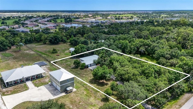 17340 Oak Creek Rd, Alva, FL 33920 - aerial view of property and surrounding area with property parcel outlined and a large body of water