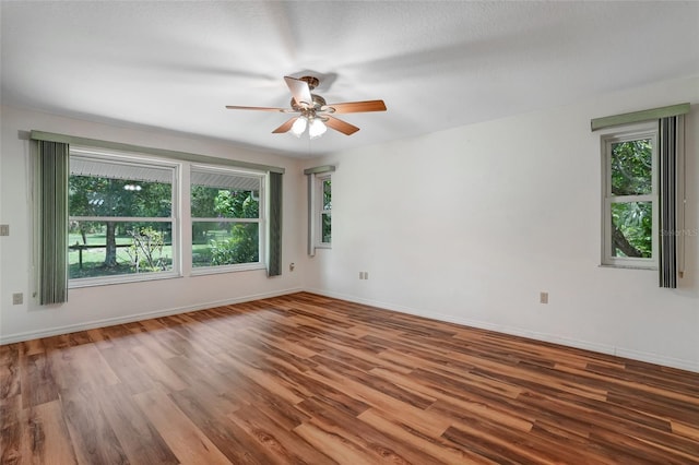 17340 Oak Creek Rd, Alva, FL 33920 - spare room featuring a ceiling fan, wood finished floors, and baseboards