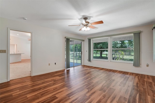 17340 Oak Creek Rd, Alva, FL 33920 - empty room with ceiling fan, wood finished floors, and baseboards