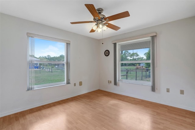 17340 Oak Creek Rd, Alva, FL 33920 - spare room with plenty of natural light, light wood-style floors, and a ceiling fan