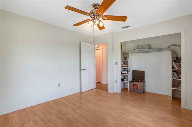 17340 Oak Creek Rd, Alva, FL 33920 - unfurnished bedroom featuring light wood finished floors, baseboards, a closet, and a ceiling fan