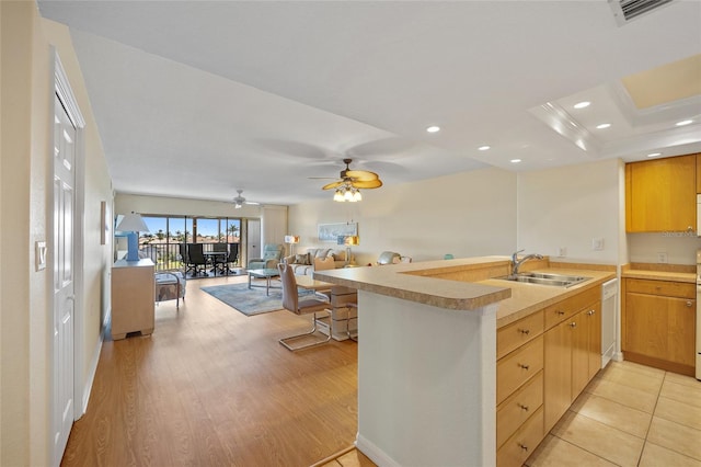 601 Shreve St Unit 21C, Punta Gorda, FL 33950 - kitchen featuring a sink, open floor plan, light countertops, recessed lighting, and ceiling fan